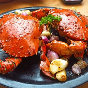 Grilled crab dish served with spices