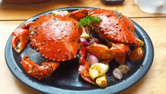 Grilled crab dish served with spices